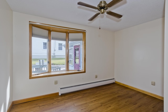282 Halladay Dr, Suffield, CT 06093 - empty room featuring a baseboard heating unit, wood finished floors, and a ceiling fan