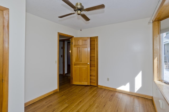 282 Halladay Dr, Suffield, CT 06093 - spare room with light wood-type flooring, a ceiling fan, and a textured ceiling