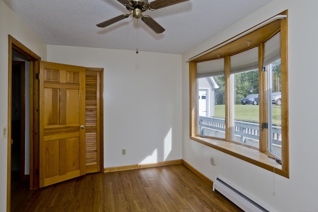 282 Halladay Dr, Suffield, CT 06093 - unfurnished room featuring baseboard heating, dark wood-style flooring, a textured ceiling, and ceiling fan