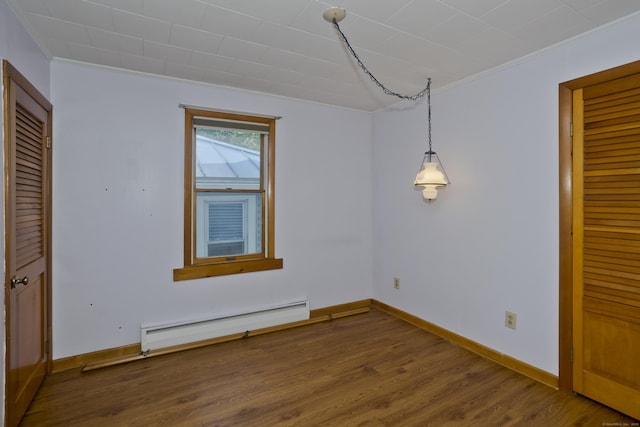 282 Halladay Dr, Suffield, CT 06093 - unfurnished dining area with a baseboard radiator, crown molding, and wood finished floors