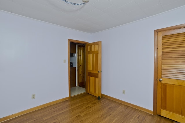 282 Halladay Dr, Suffield, CT 06093 - unfurnished bedroom featuring ornamental molding and wood finished floors