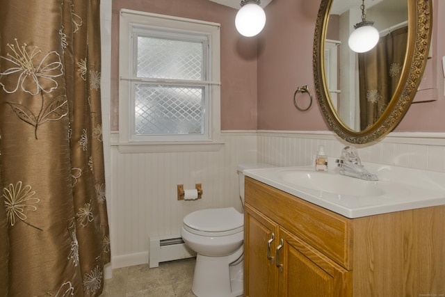 282 Halladay Dr, Suffield, CT 06093 - bathroom featuring baseboard heating, vanity, wainscoting, and tile patterned flooring