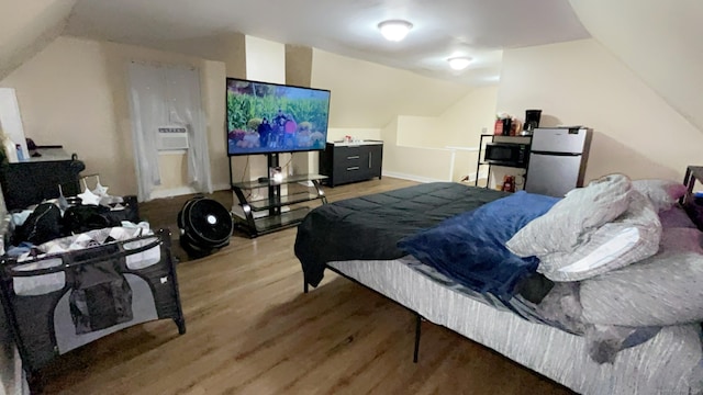 115 Lloyd St, New Haven, CT 06513 - bedroom with lofted ceiling, freestanding refrigerator, and wood finished floors