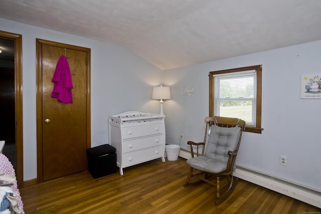 26 Sandpiper Rd, Enfield, CT 06082 - living area with a baseboard heating unit, wood finished floors, and lofted ceiling