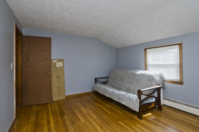 26 Sandpiper Rd, Enfield, CT 06082 - bedroom with lofted ceiling, hardwood / wood-style floors, and a baseboard radiator