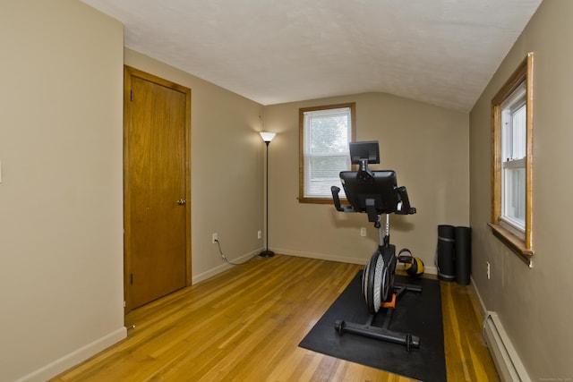 26 Sandpiper Rd, Enfield, CT 06082 - workout area with baseboard heating, light wood-style flooring, and vaulted ceiling