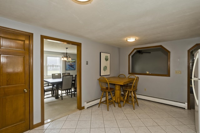 26 Sandpiper Rd, Enfield, CT 06082 - dining area featuring a chandelier, light tile patterned flooring, and a baseboard heating unit