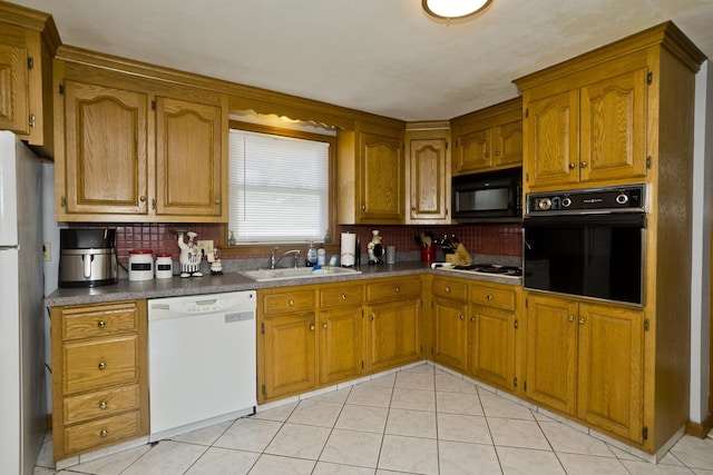 26 Sandpiper Rd, Enfield, CT 06082 - kitchen featuring black appliances, decorative backsplash, brown cabinets, light tile patterned flooring, and dark countertops