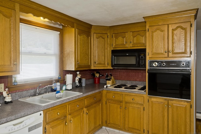 26 Sandpiper Rd, Enfield, CT 06082 - kitchen with black appliances, decorative backsplash, and brown cabinetry