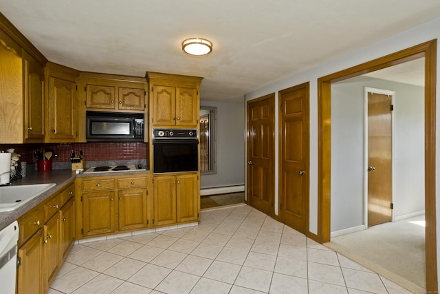 26 Sandpiper Rd, Enfield, CT 06082 - kitchen with black appliances, a baseboard heating unit, brown cabinetry, decorative backsplash, and light tile patterned floors