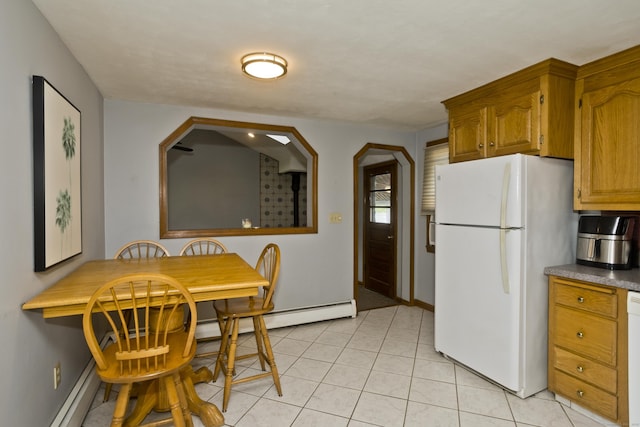 26 Sandpiper Rd, Enfield, CT 06082 - kitchen featuring white appliances, baseboard heating, brown cabinetry, and light tile patterned floors