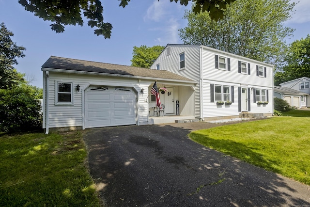 26 Sandpiper Rd, Enfield, CT 06082 - colonial inspired home featuring a garage, a front lawn, and asphalt driveway