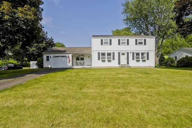 26 Sandpiper Rd, Enfield, CT 06082 - colonial house featuring driveway, an attached garage, a front lawn, and a porch
