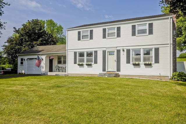 26 Sandpiper Rd, Enfield, CT 06082 - view of front facade with a garage and a front yard