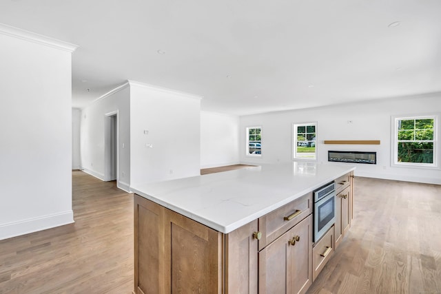 LotA Roseville Street, Fairfield, CT 06825 - kitchen featuring open floor plan, light wood-type flooring, healthy amount of natural light, and ornamental molding