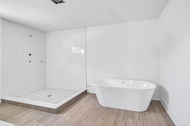 LotA Roseville Street, Fairfield, CT 06825 - full bath with a freestanding bath, wood finished floors, and a tile shower