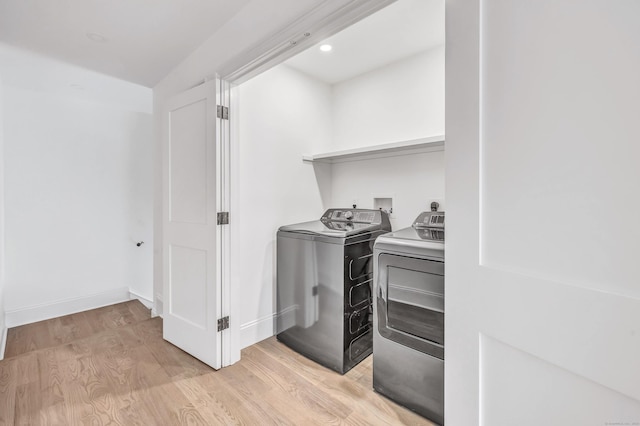 LotA Roseville Street, Fairfield, CT 06825 - washroom with washing machine and clothes dryer, light wood-style floors, and recessed lighting