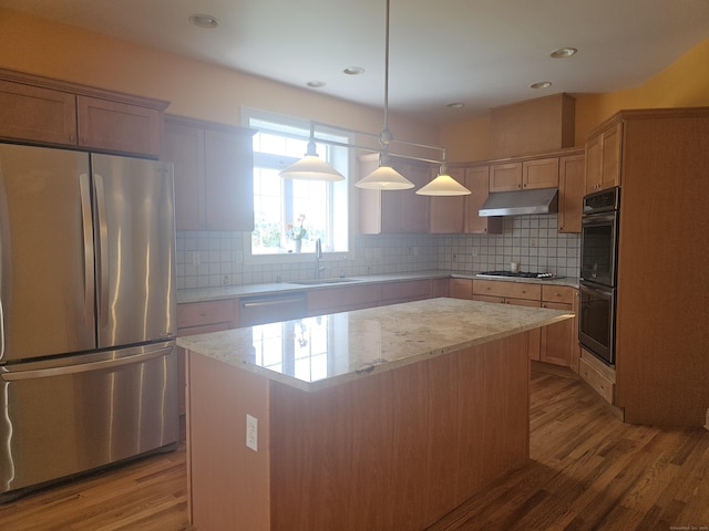 41 Mesa Dr, Bethany, CT 06524 - kitchen with stainless steel appliances, under cabinet range hood, a center island, light wood-style floors, and recessed lighting