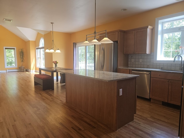 41 Mesa Dr, Bethany, CT 06524 - kitchen with stainless steel appliances, dark wood-type flooring, a kitchen island, decorative backsplash, and lofted ceiling