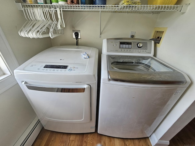 41 Mesa Dr, Bethany, CT 06524 - washroom with a baseboard heating unit, washing machine and clothes dryer, and wood finished floors