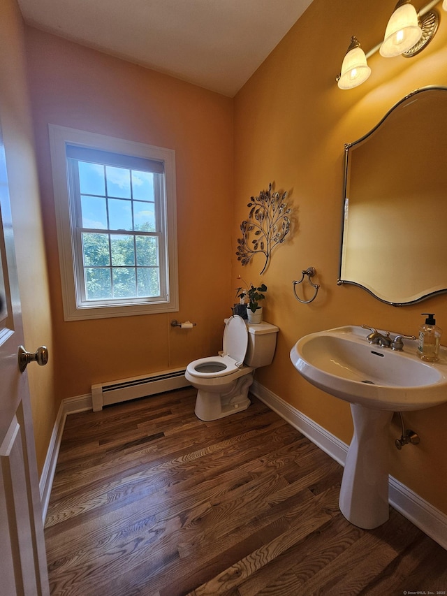 41 Mesa Dr, Bethany, CT 06524 - half bathroom with a baseboard heating unit and wood finished floors