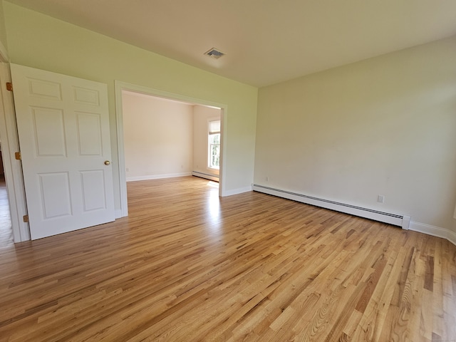 41 Mesa Dr, Bethany, CT 06524 - unfurnished room featuring a baseboard heating unit and light wood finished floors