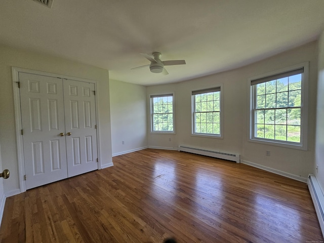 41 Mesa Dr, Bethany, CT 06524 - unfurnished bedroom featuring a baseboard heating unit, wood finished floors, and ceiling fan