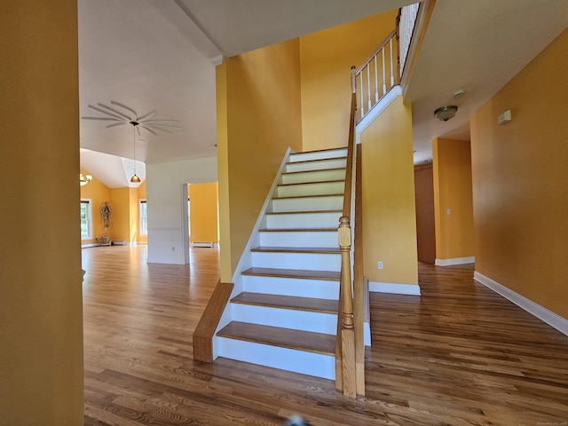 41 Mesa Dr, Bethany, CT 06524 - stairs with wood finished floors, a baseboard radiator, ceiling fan, and vaulted ceiling