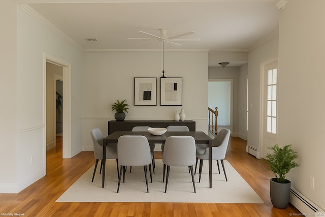 41 Mesa Dr, Bethany, CT 06524 - dining space featuring a baseboard heating unit, ceiling fan, light wood-type flooring, and crown molding