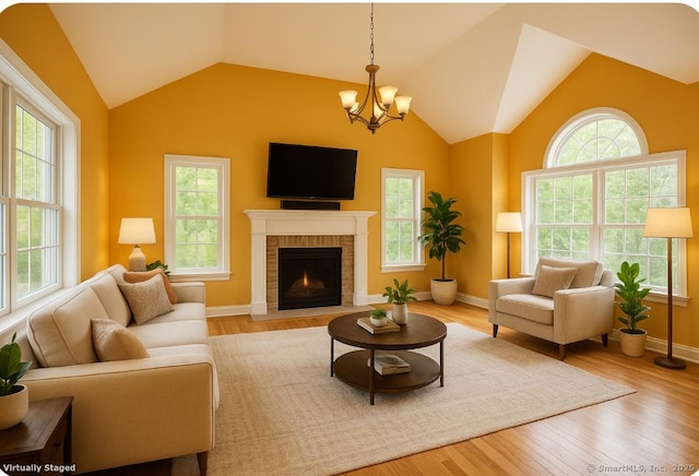 41 Mesa Dr, Bethany, CT 06524 - living room with healthy amount of natural light, lofted ceiling, a chandelier, and a brick fireplace