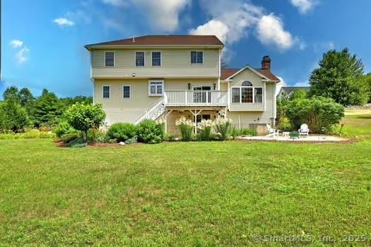 41 Mesa Dr, Bethany, CT 06524 - rear view of house with stairway, a wooden deck, and a lawn