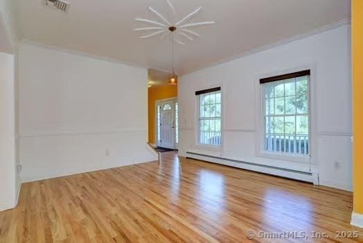 41 Mesa Dr, Bethany, CT 06524 - unfurnished room featuring a baseboard radiator and wood finished floors