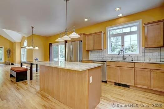41 Mesa Dr, Bethany, CT 06524 - kitchen with appliances with stainless steel finishes, light wood-type flooring, decorative backsplash, healthy amount of natural light, and recessed lighting