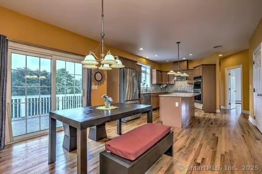 41 Mesa Dr, Bethany, CT 06524 - dining area with a chandelier, light wood-style flooring, and recessed lighting