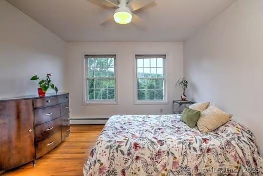 41 Mesa Dr, Bethany, CT 06524 - bedroom featuring light wood-style floors, a baseboard heating unit, and ceiling fan