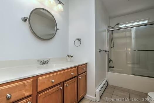 41 Mesa Dr, Bethany, CT 06524 - bathroom featuring baseboard heating, vanity, tile patterned flooring, and combined bath / shower with glass door
