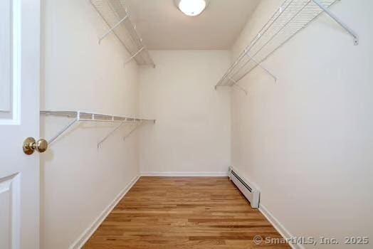 41 Mesa Dr, Bethany, CT 06524 - walk in closet featuring a baseboard radiator and light wood-type flooring