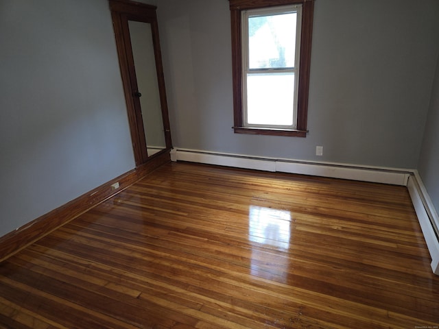 64 Pine St, Torrington, CT 06790 - empty room featuring a baseboard radiator and hardwood / wood-style flooring