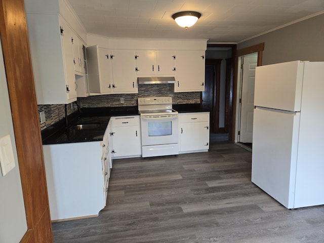 64 Pine St, Torrington, CT 06790 - kitchen featuring white appliances, under cabinet range hood, dark countertops, backsplash, and white cabinetry