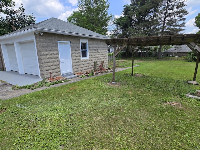 64 Pine St, Torrington, CT 06790 - rear view of property featuring a shingled roof, a lawn, concrete block siding, and a garage