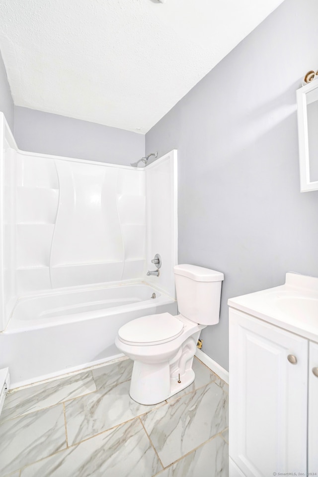 50 Angel Dr Apt D, Waterbury, CT 06708 - bathroom with vanity, washtub / shower combination, marble look tiles, and a textured ceiling