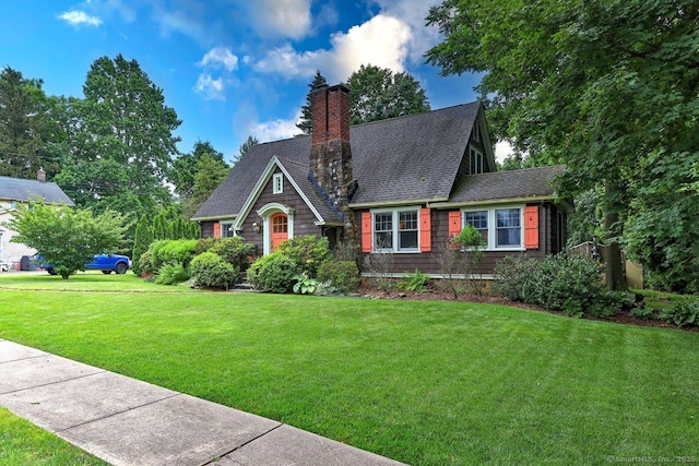345 Spring St, Cheshire, CT 06410 - view of front of house with a front yard, a chimney, and roof with shingles
