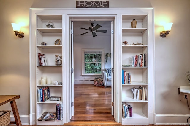 345 Spring St, Cheshire, CT 06410 - corridor with wood finished floors, a baseboard heating unit, and built in features