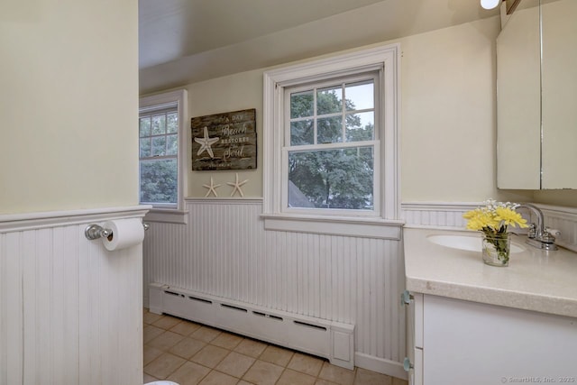345 Spring St, Cheshire, CT 06410 - bathroom featuring a baseboard radiator, a wainscoted wall, vanity, and tile patterned floors