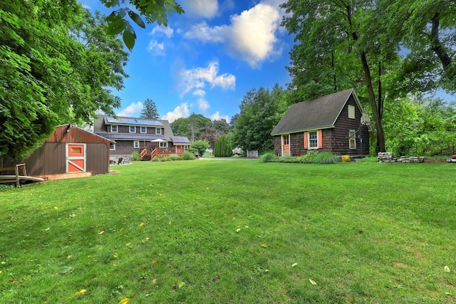 345 Spring St, Cheshire, CT 06410 - view of grassy yard featuring a storage shed