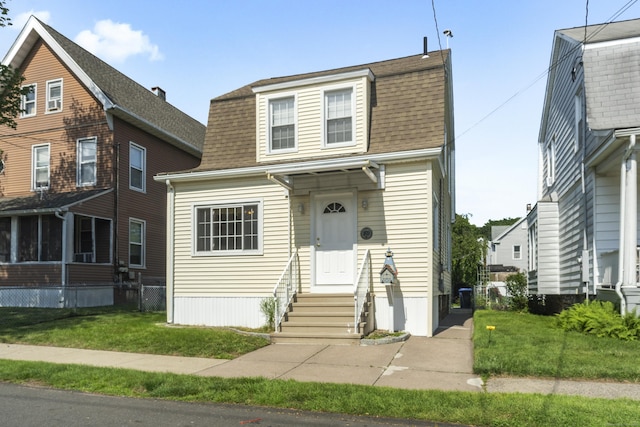 169 Peck Ave, West Haven, CT 06516 - dutch colonial featuring entry steps, roof with shingles, and a front yard