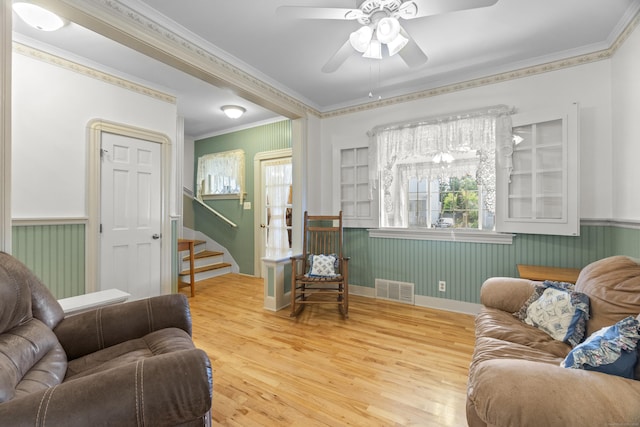 169 Peck Ave, West Haven, CT 06516 - living room featuring wood finished floors, wainscoting, ceiling fan, ornamental molding, and stairway