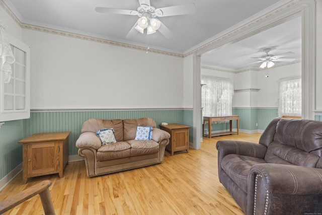 169 Peck Ave, West Haven, CT 06516 - living area with ceiling fan, a wainscoted wall, light wood finished floors, and crown molding