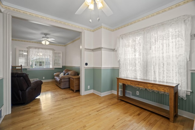 169 Peck Ave, West Haven, CT 06516 - living area with ceiling fan, wainscoting, wood finished floors, and ornamental molding
