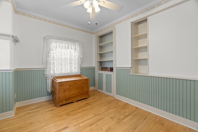 169 Peck Ave, West Haven, CT 06516 - unfurnished room featuring wainscoting, wood finished floors, ceiling fan, and crown molding